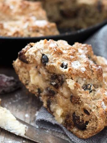 fig and walnut soda bread sliced with knife and butter