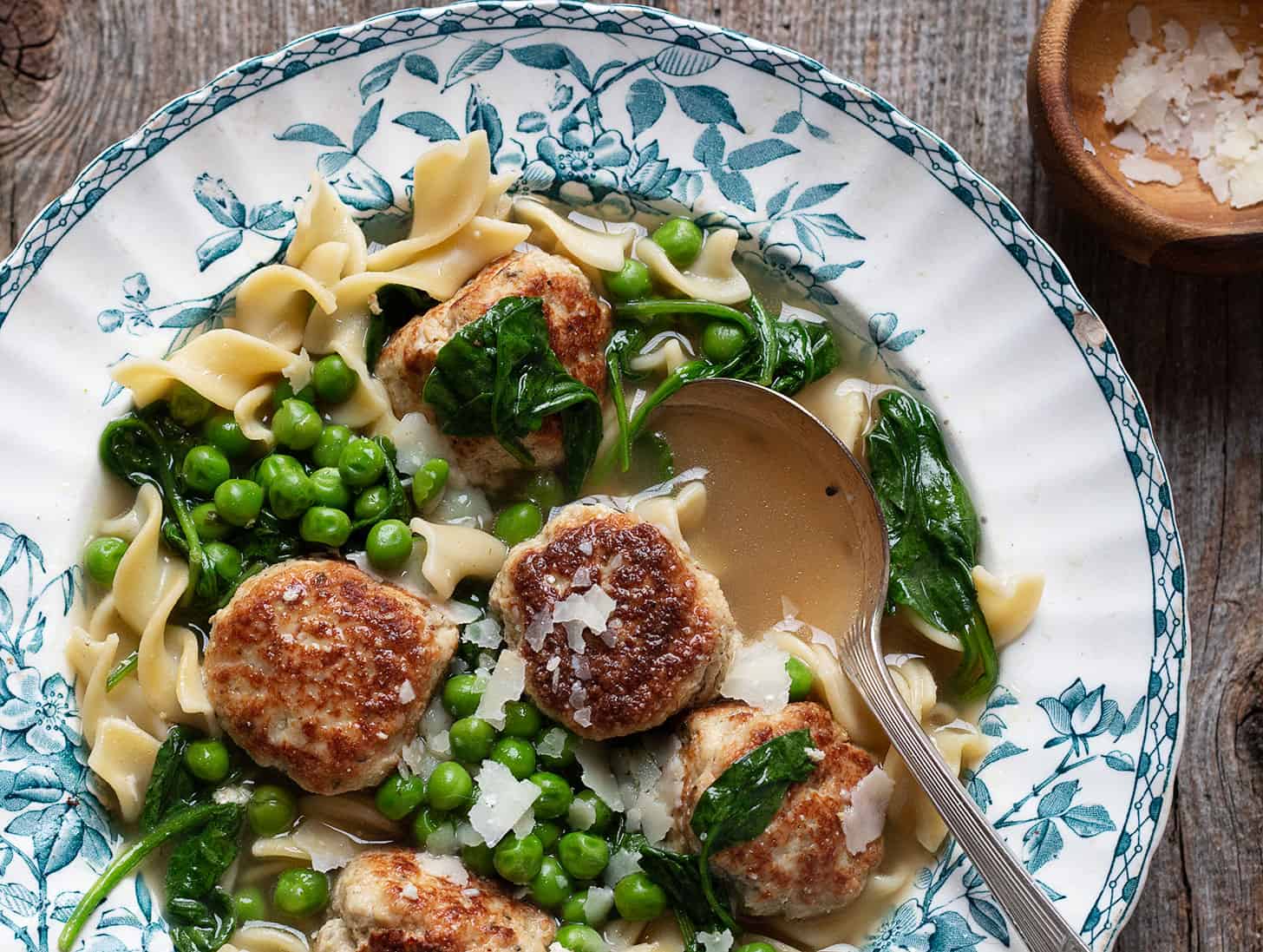 pork meatball soup in bowl with spoon