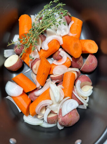 vegetables in the bottom of the slow cooker