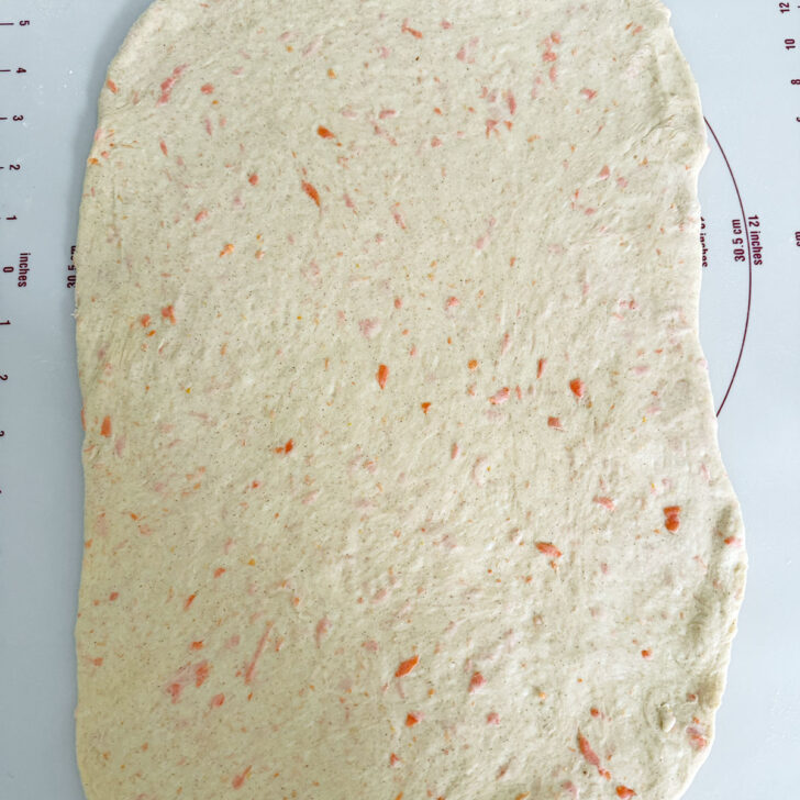 Dough rolled out into a rectangle.