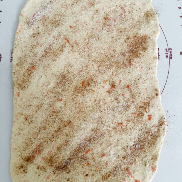 Dough sprinkled with cinnamon and sugar.