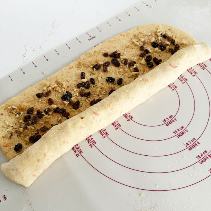 Rolling the dough up jelly roll style.