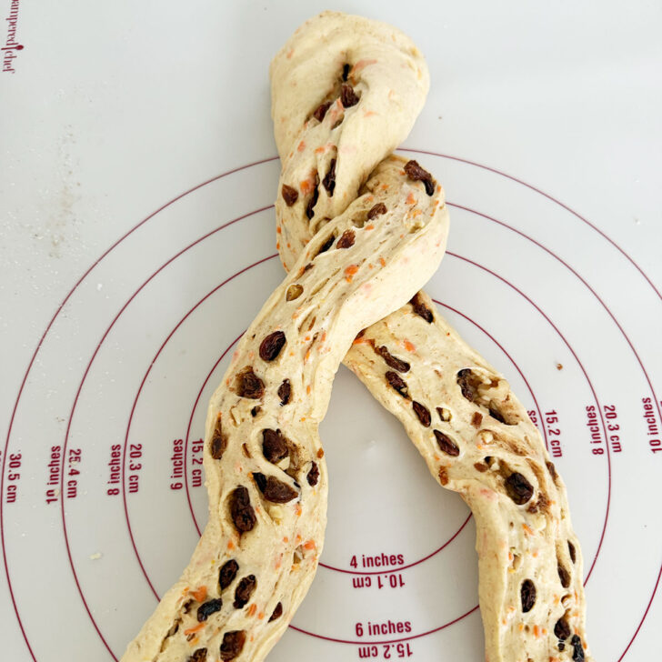 Twisting the dough strands together.