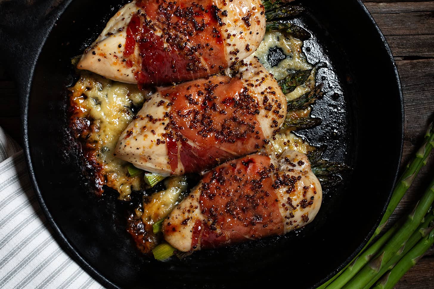 asparagus havarti stuffed chicken in cast iron skillet