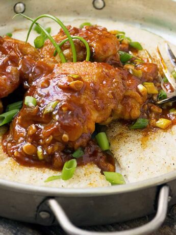 Korean chicken with crispy rice in pan