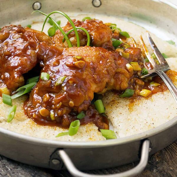 Korean chicken with crispy rice in pan