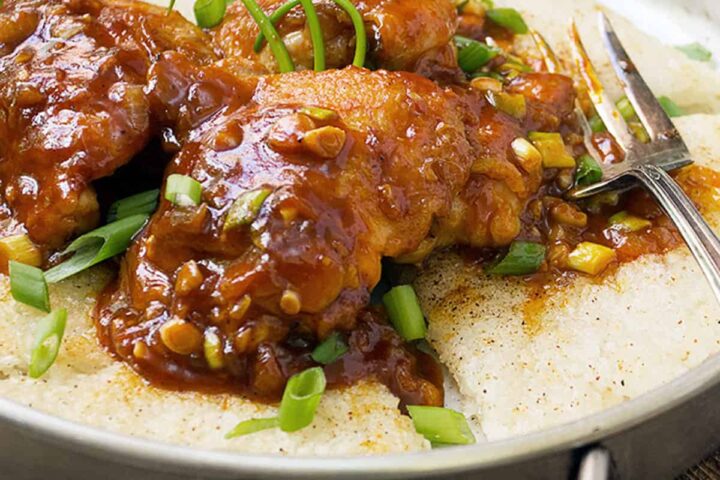 Korean chicken with crispy rice in pan