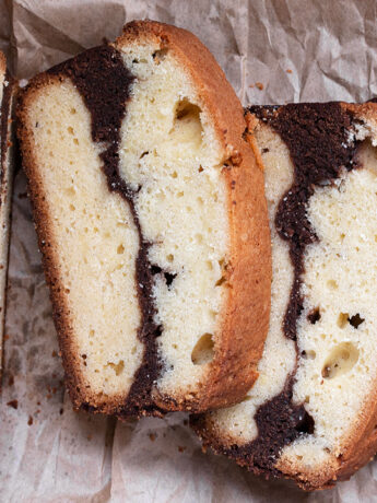 marble pound cake loaf sliced on parchment paper