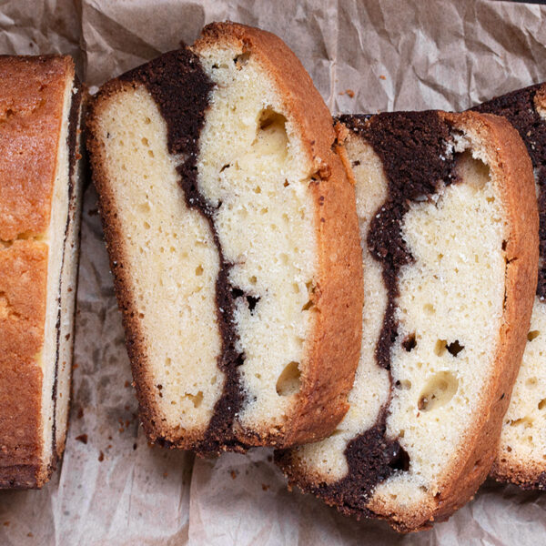 marble pound cake loaf sliced on parchment paper
