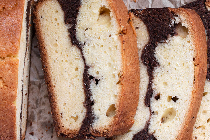 marble pound cake loaf sliced on parchment paper