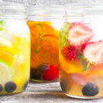 cold brewed iced tea with fruit in mason jars