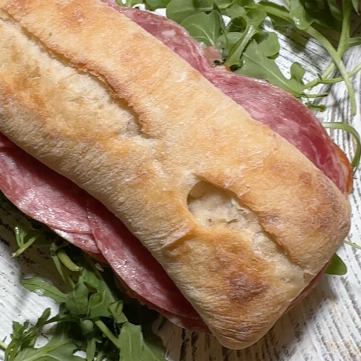 To half of the ciabatta loaf placed on the sandwich.