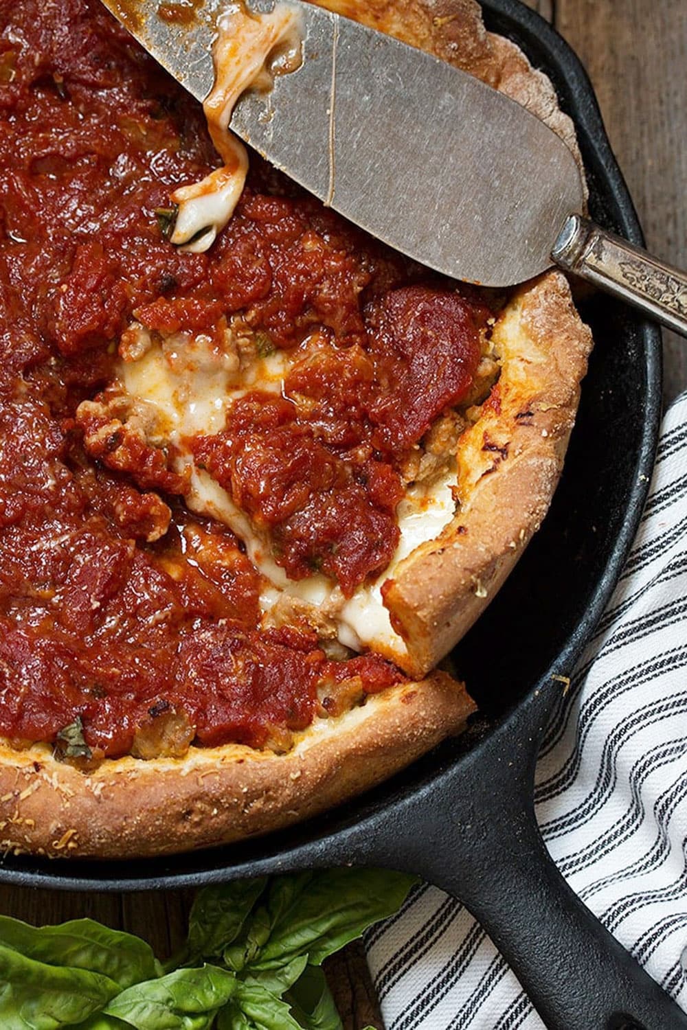 deep dish pizza in cast iron skillet