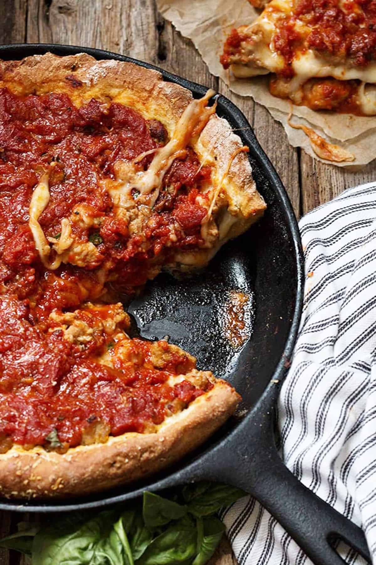 deep dish pizza in cast iron skillet