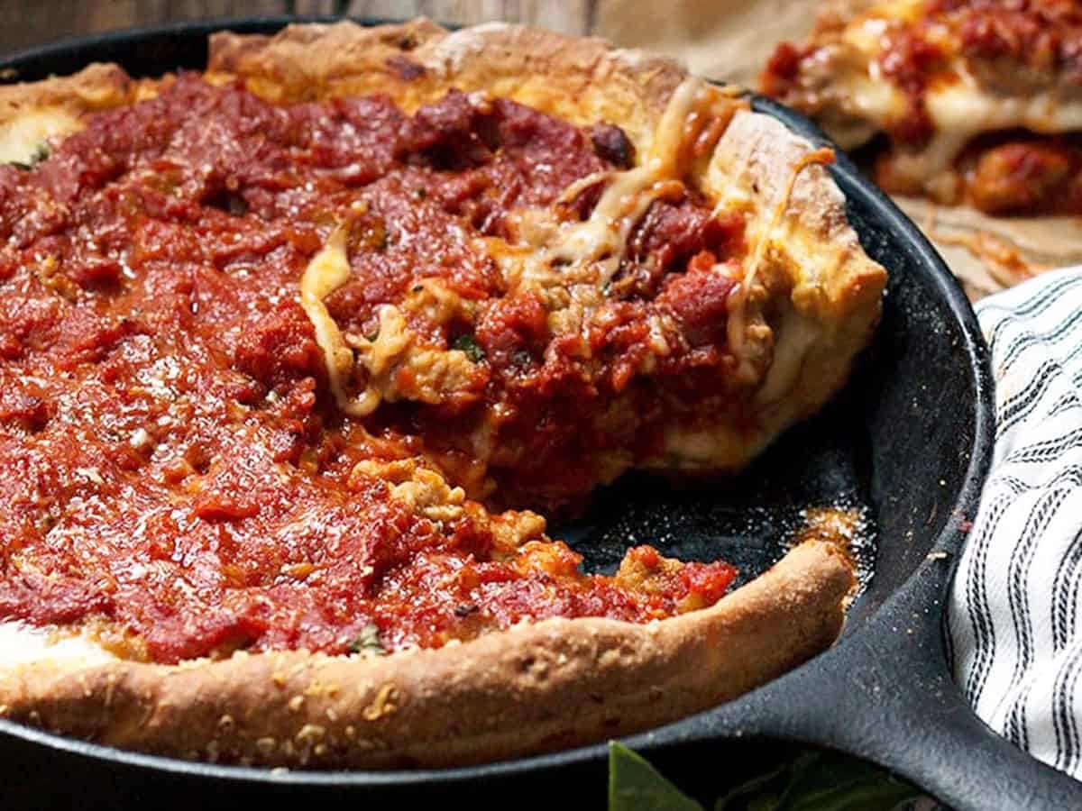 deep dish pizza in cast iron skillet