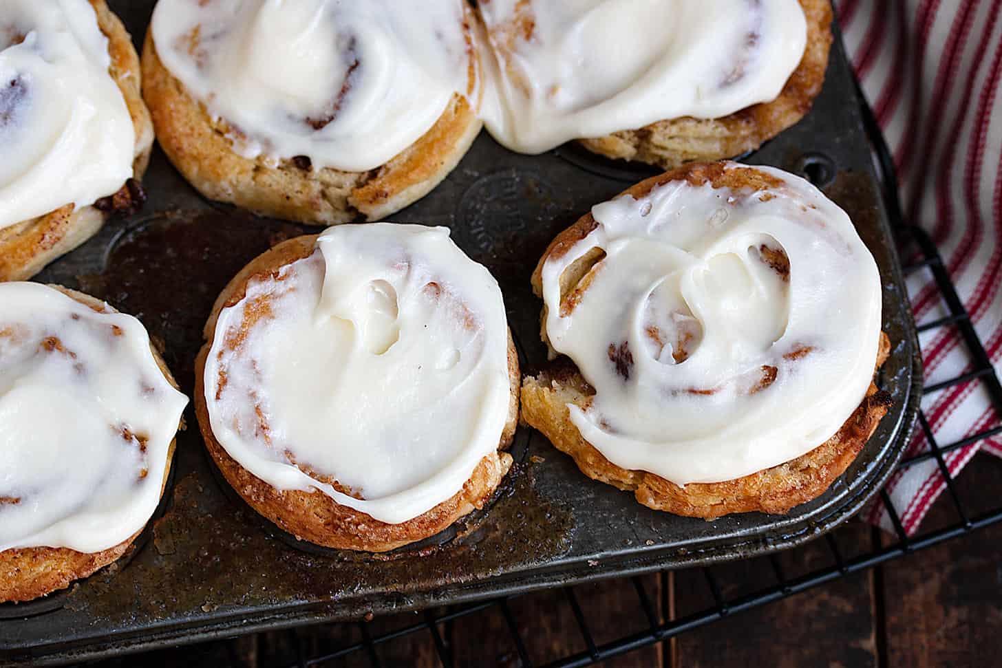 cinnamon roll biscuits in muffin tin