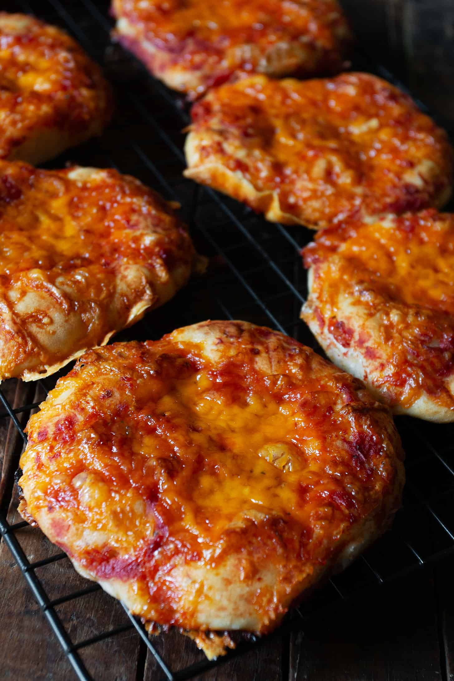 Easy pizza buns cooling on a wire rack.