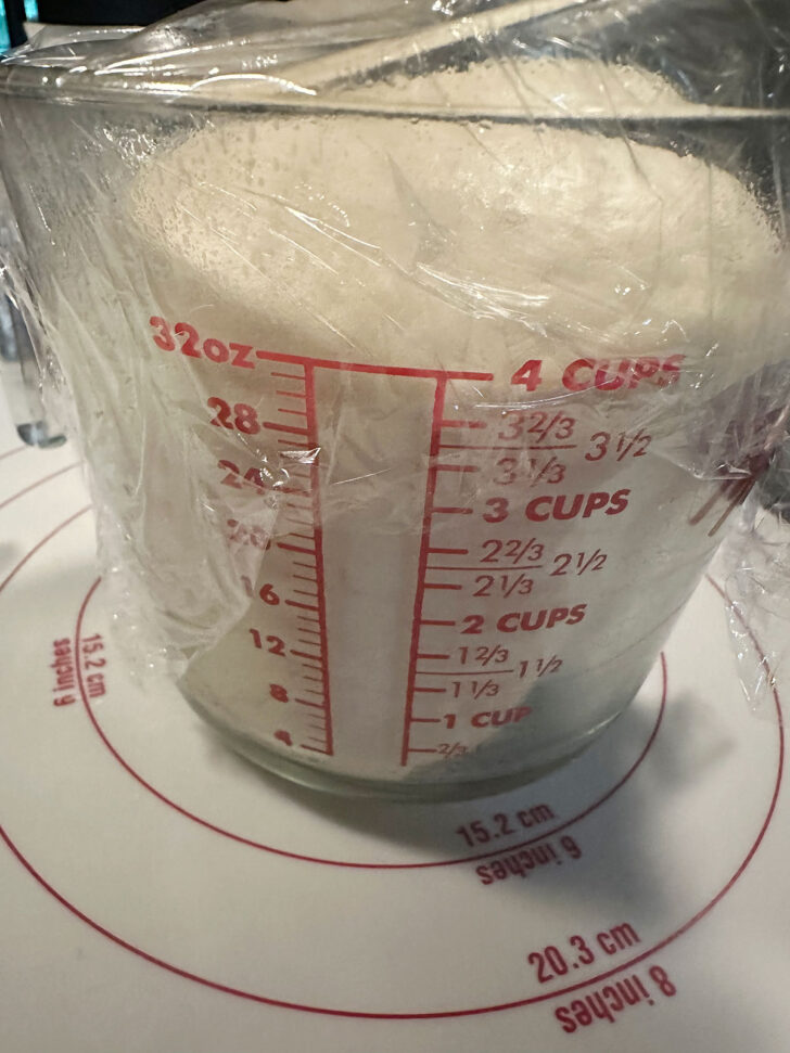 Pizza buns dough after rising until doubled.