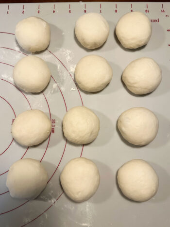 12 pieces of dough on work surface