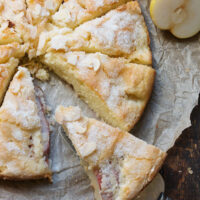 French pear cake sliced on parchment