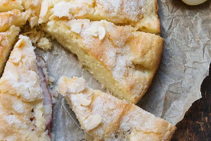 French pear cake sliced on parchment