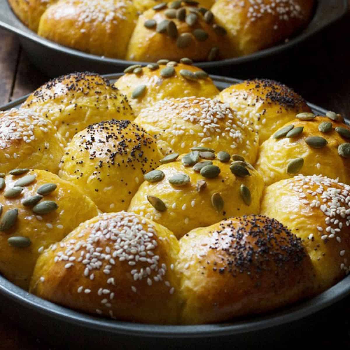 honey pumpkin rolls in baking pans