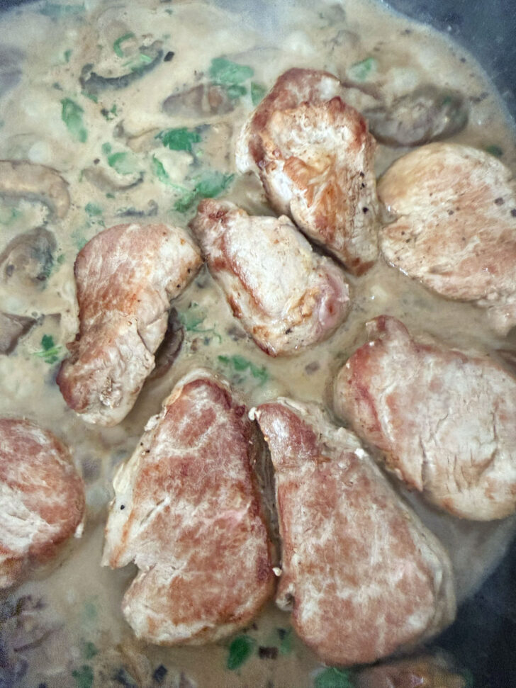 Pork medallions returned to the skillet with the creamy Marsala sauce.