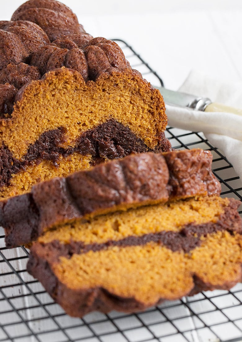 pumpkin loaf marbled with chocolate brownie on cooling rack