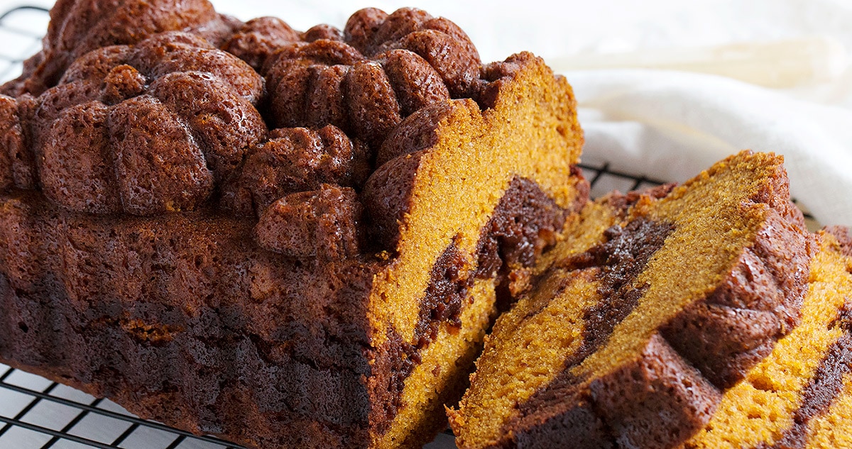 pumpkin loaf marbled with chocolate brownie on cooling rack