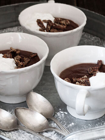 hot cocoa pudding in cups with spoons