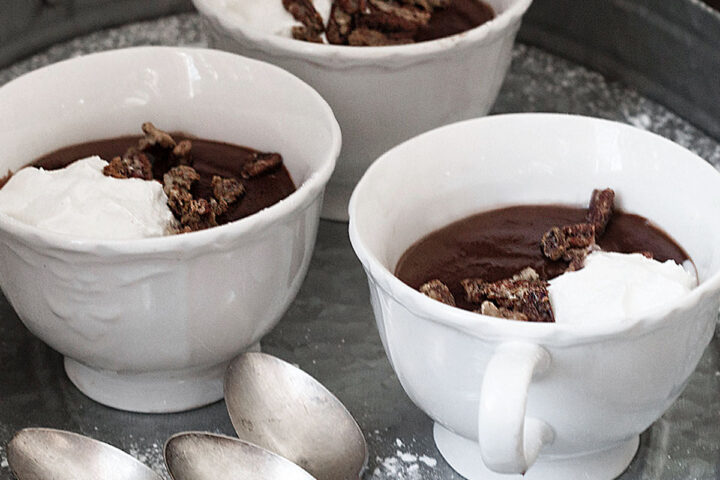 hot cocoa pudding in cups with spoons