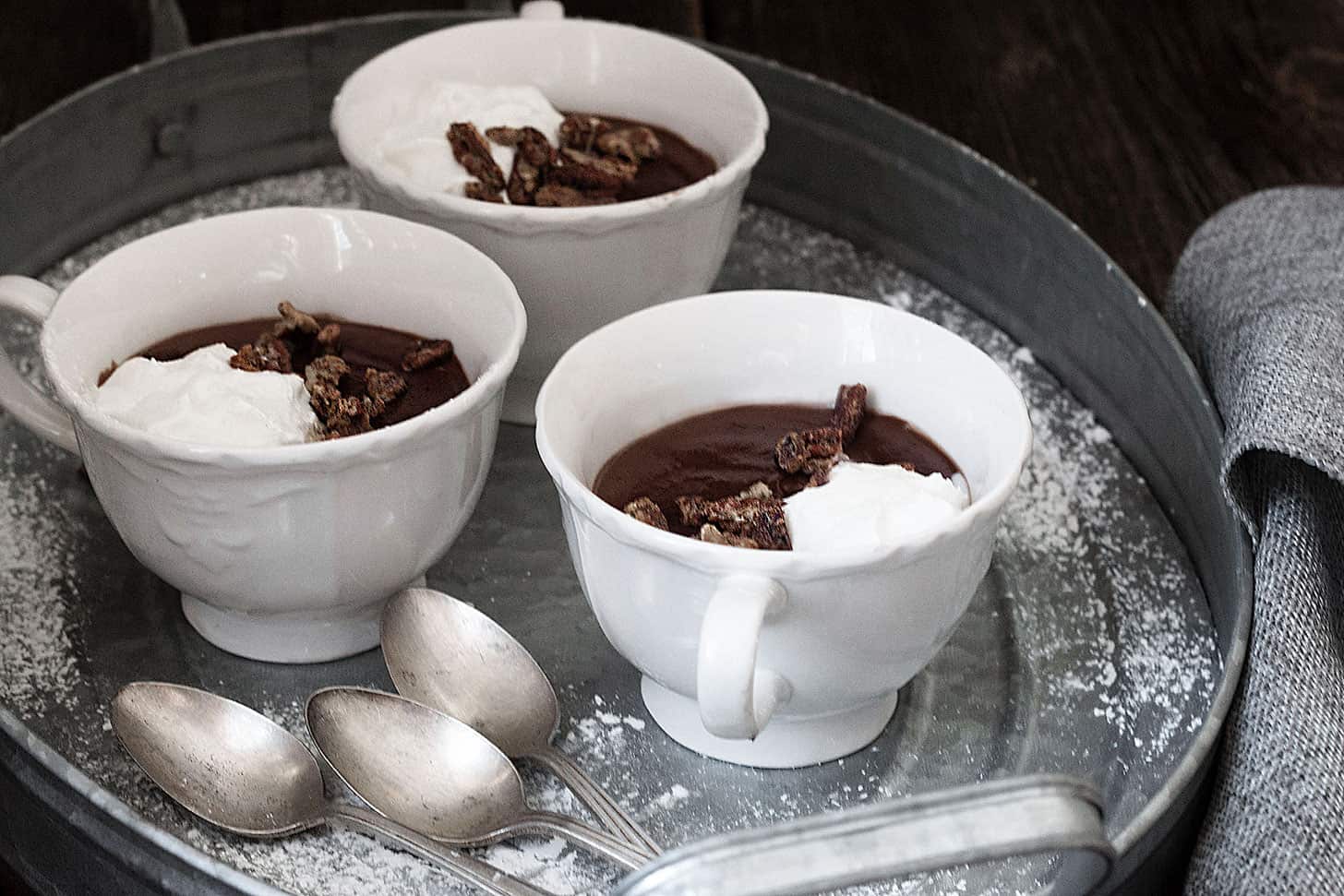 hot cocoa pudding in cups with spoons