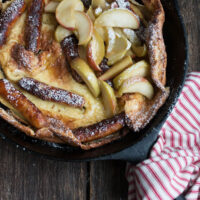 sausage and apple Dutch baby in cast iron skillet