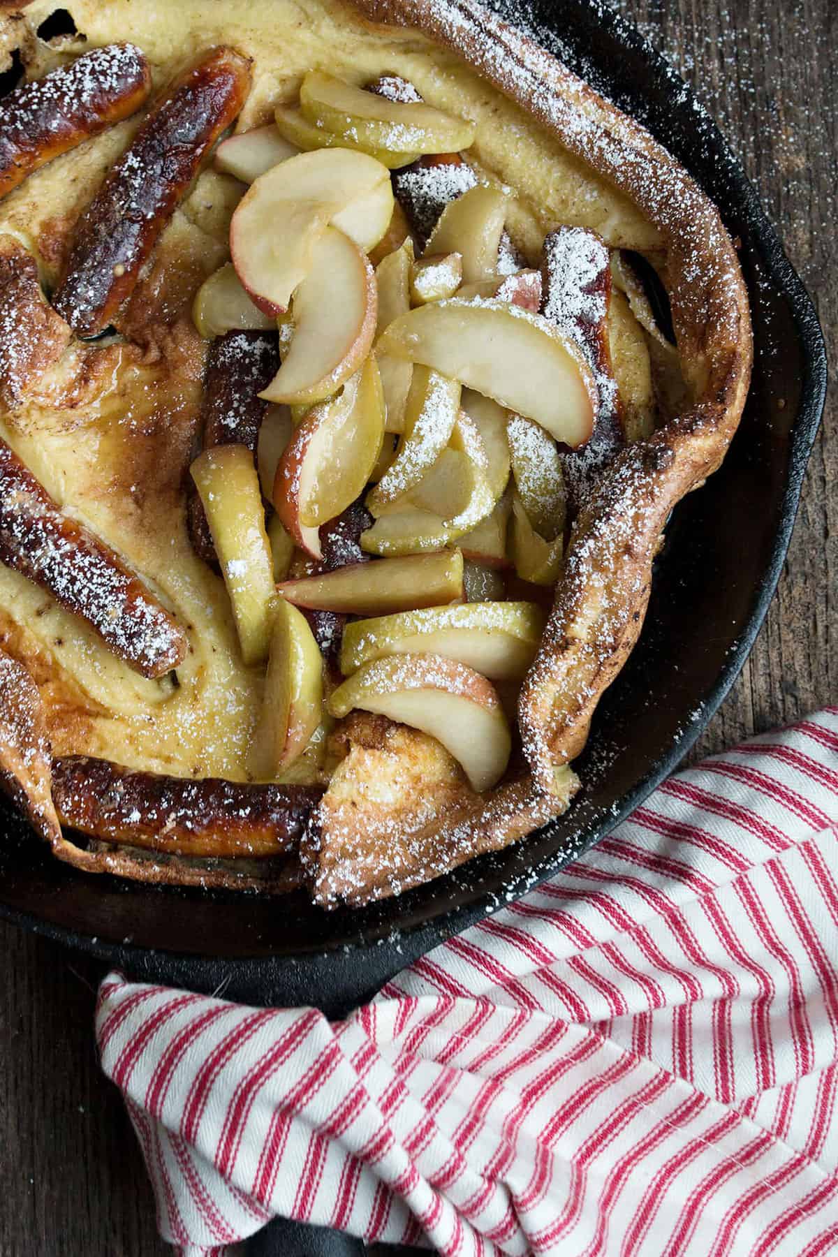 sausage and apple Dutch baby in cast iron skillet