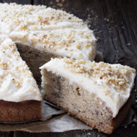 banana cake with cream cheese frosting sliced