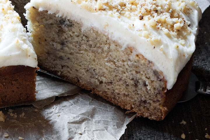 banana cake with cream cheese frosting sliced