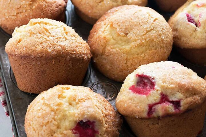 cranberry orange muffins in muffin tin