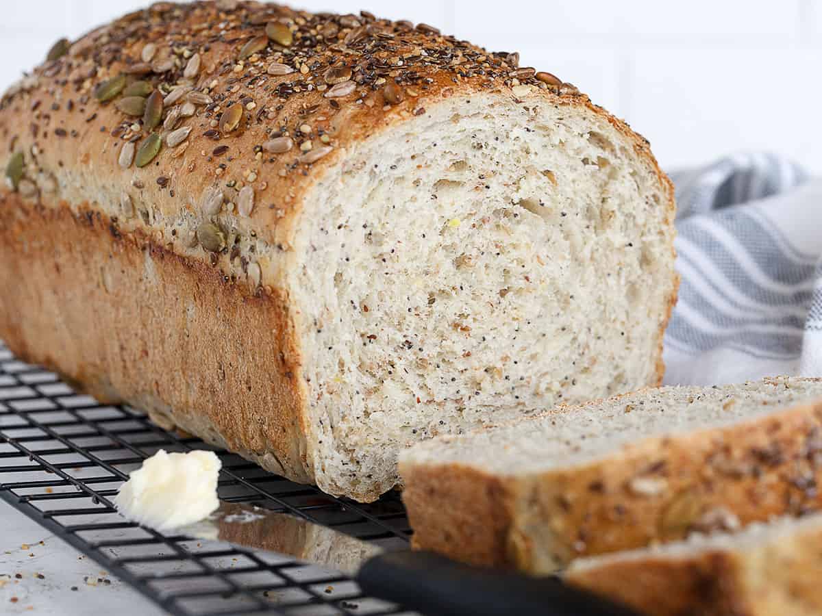 seeded multigrain bread sliced on cooling rack