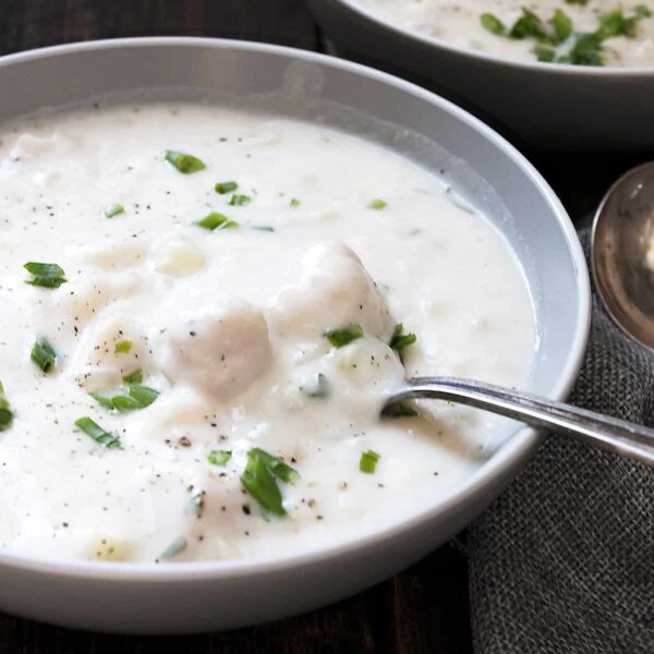 thick and creamy seafood chowder in bowl with spoon