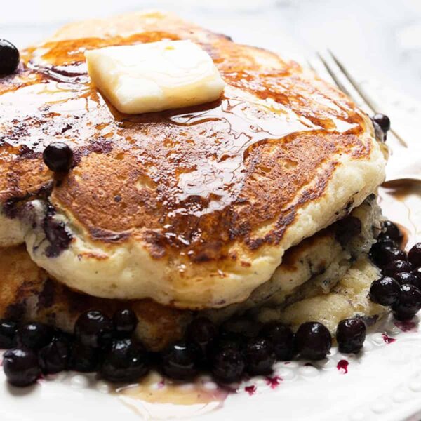 stack of blueberry pancakes on plate