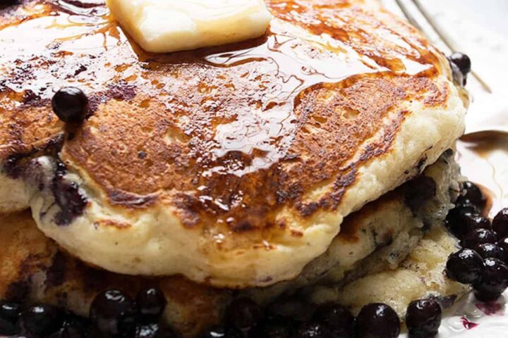 stack of blueberry pancakes on plate