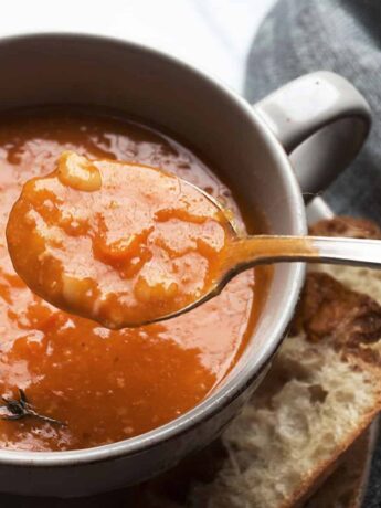Instant pot bean with bacon soup in bowl with spoon