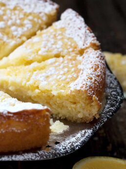 lemon cream butter cake sliced on platter