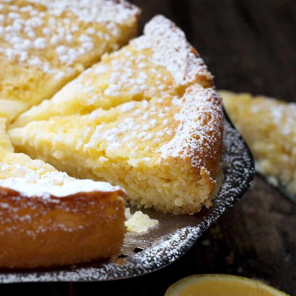 lemon cream butter cake sliced on platter