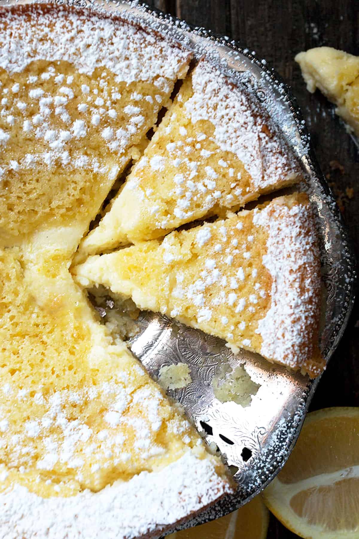 lemon cream butter cake sliced on platter