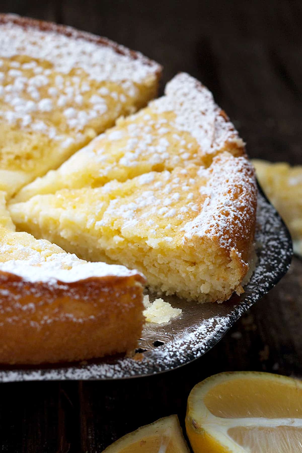 lemon cream butter cake sliced on platter