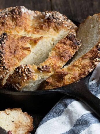 seeded asiago soda bread sliced in skillet