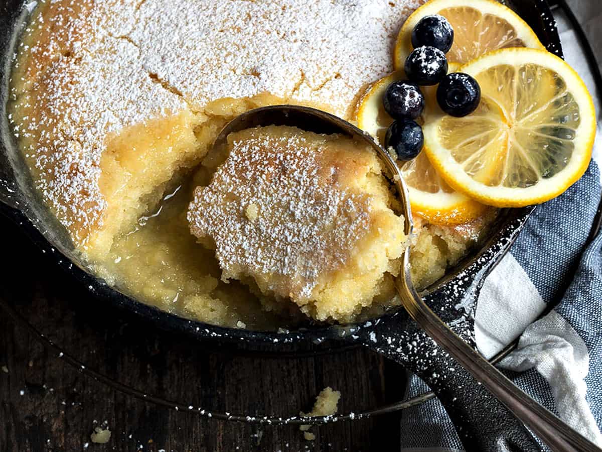 lemon cake and sauce in cast iron skillet