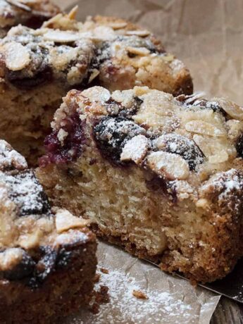 cherry almond coffee cakes sliced on parchment paper