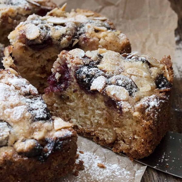 cherry almond coffee cakes sliced on parchment paper